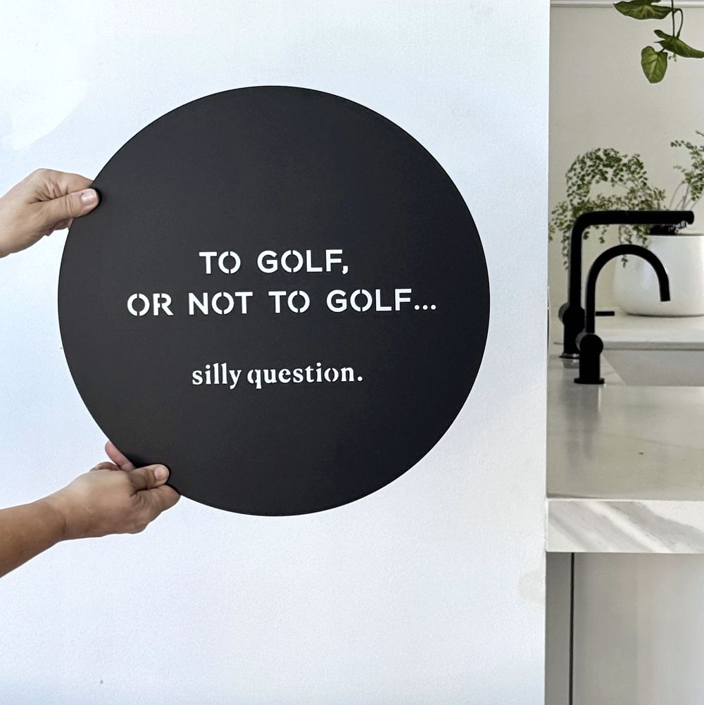 To golf or not to golf wall art in matt black steel, 40cm diameter, NZ made gift for a golfer