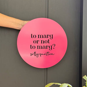 Bright pink wall art with the quote ‘to marg or not to marg’ fun cocktail themed décor