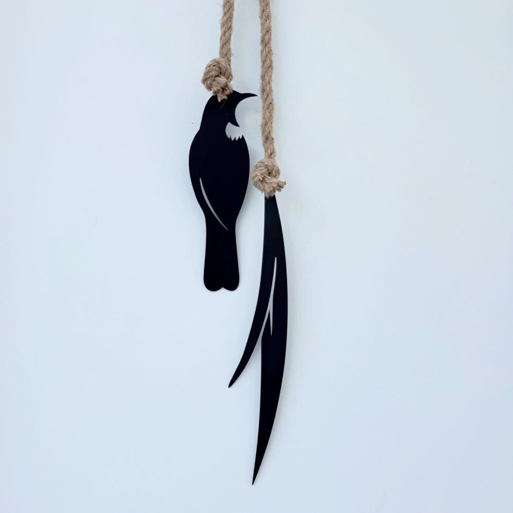 tui and fine flax wall hanging in modern New Zealand home. 
