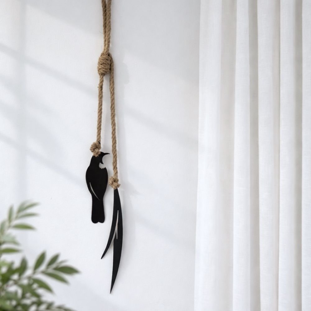 tui and fine flax wall hanging in modern New Zealand home. 