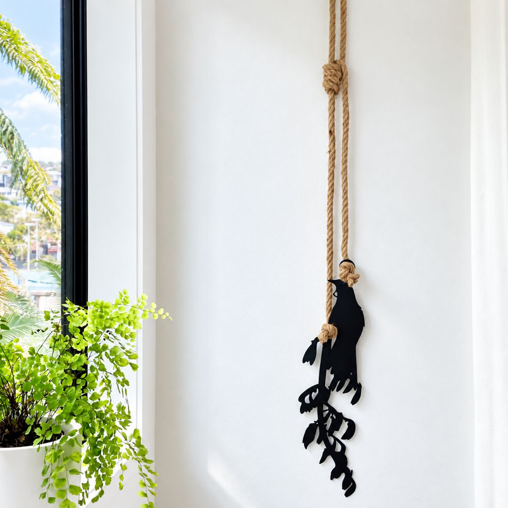 Tui & Flax black steel wall art in living room with natural lighting