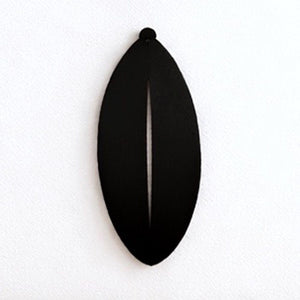 Close up of simple leaf metal wall art in matte black aluminium showing clean silhouette edges