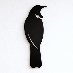 Close up detail of matte black tui wall art cut from 3mm aluminium