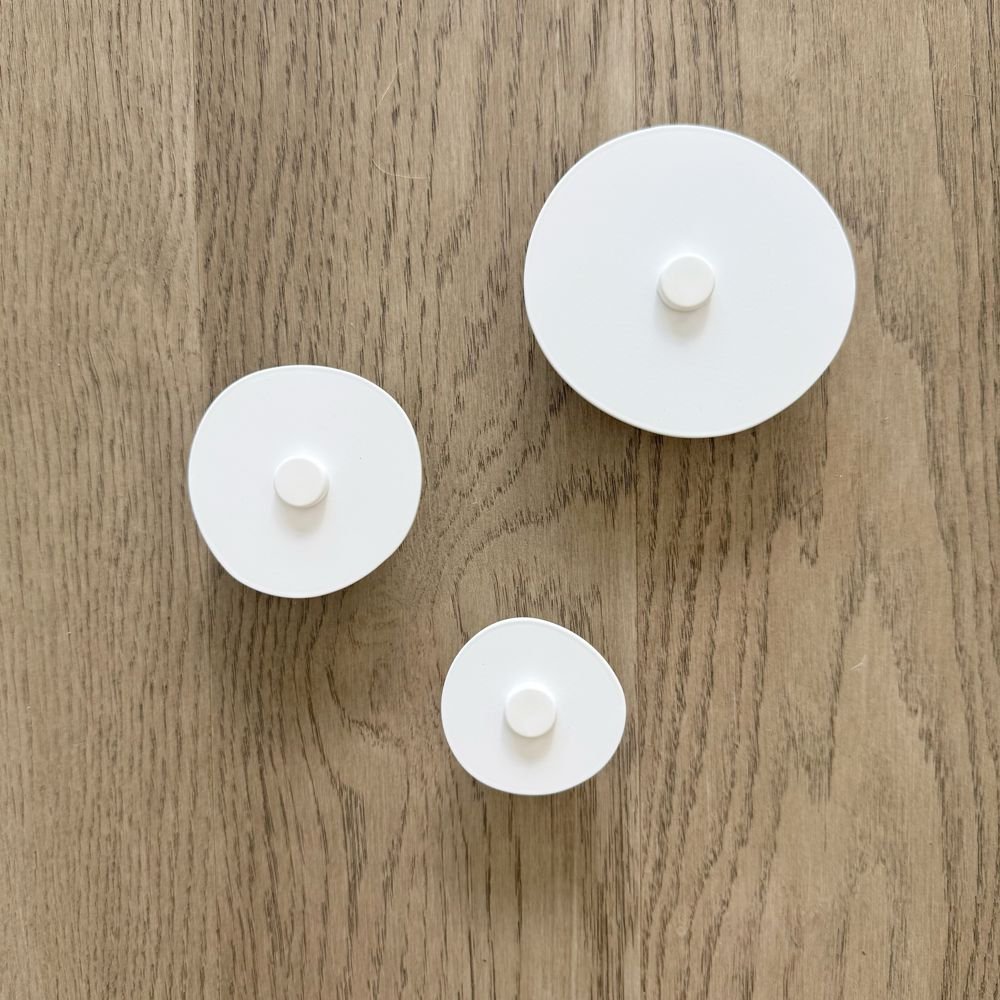 Modern white wall hooks set of three in entryway inspired by wabi sabi design suitable for indoor or outdoor use