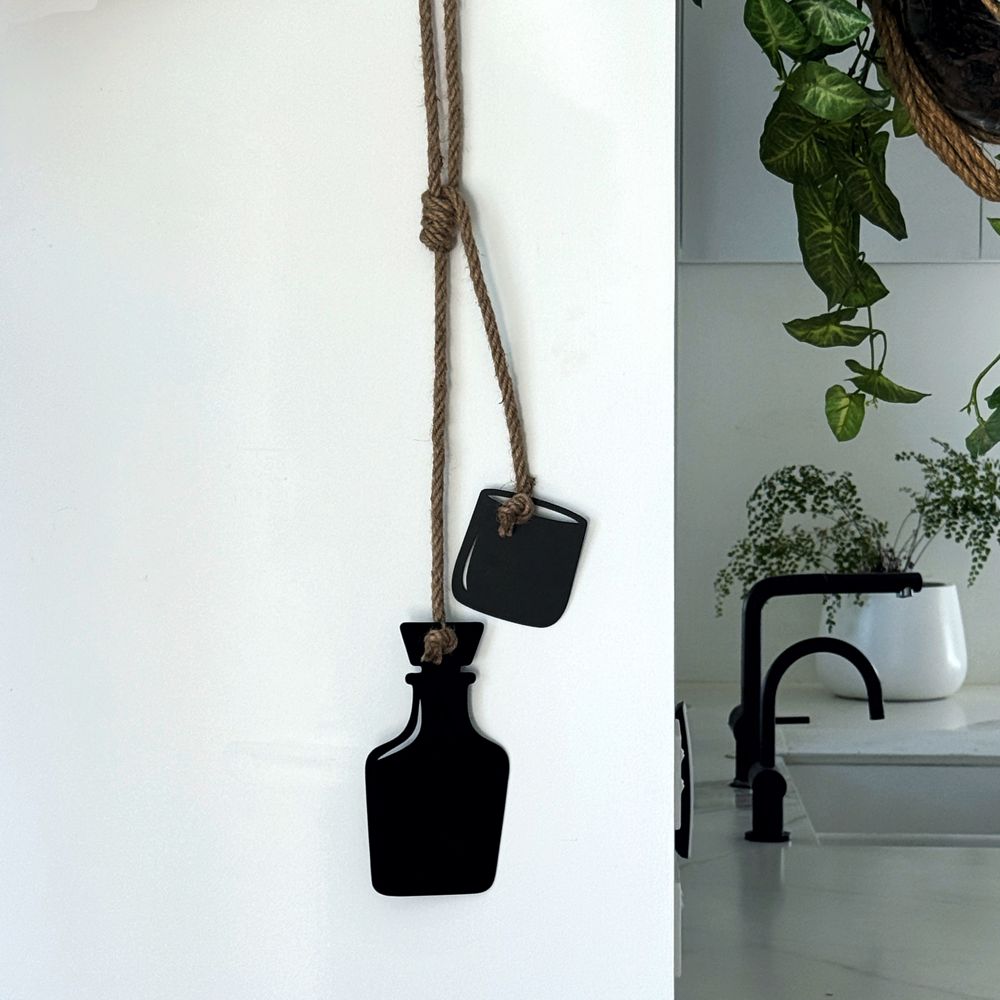 Whiskey bottle and glass wall hanging in matt black steel on jute rope, NZ made by LisaSarah