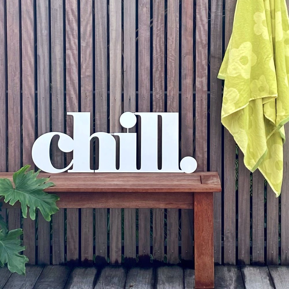 NZ Garden art for walls.  Large metal "chill" word for outdoor space.