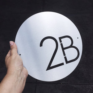 Modern marine grade brushed stainless steel (316) custom house number NZ. LisaSarah Steel Designs NZ