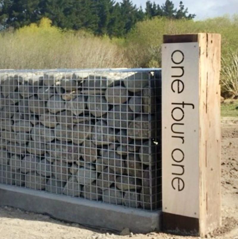 Large corten steel bespoke house number sign in words NZ.