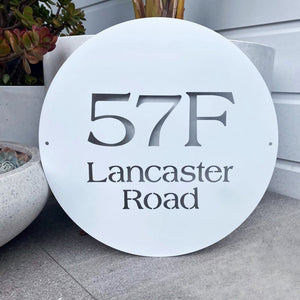 Traditional style round laser cut address sign in white steel.  