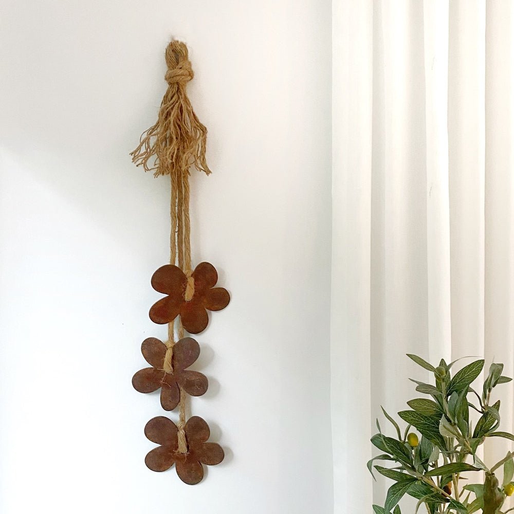 Corten and rope daisy flower wall hanging for indoors and outdoors.  NZ made by LisaSarah Steel Designs. 