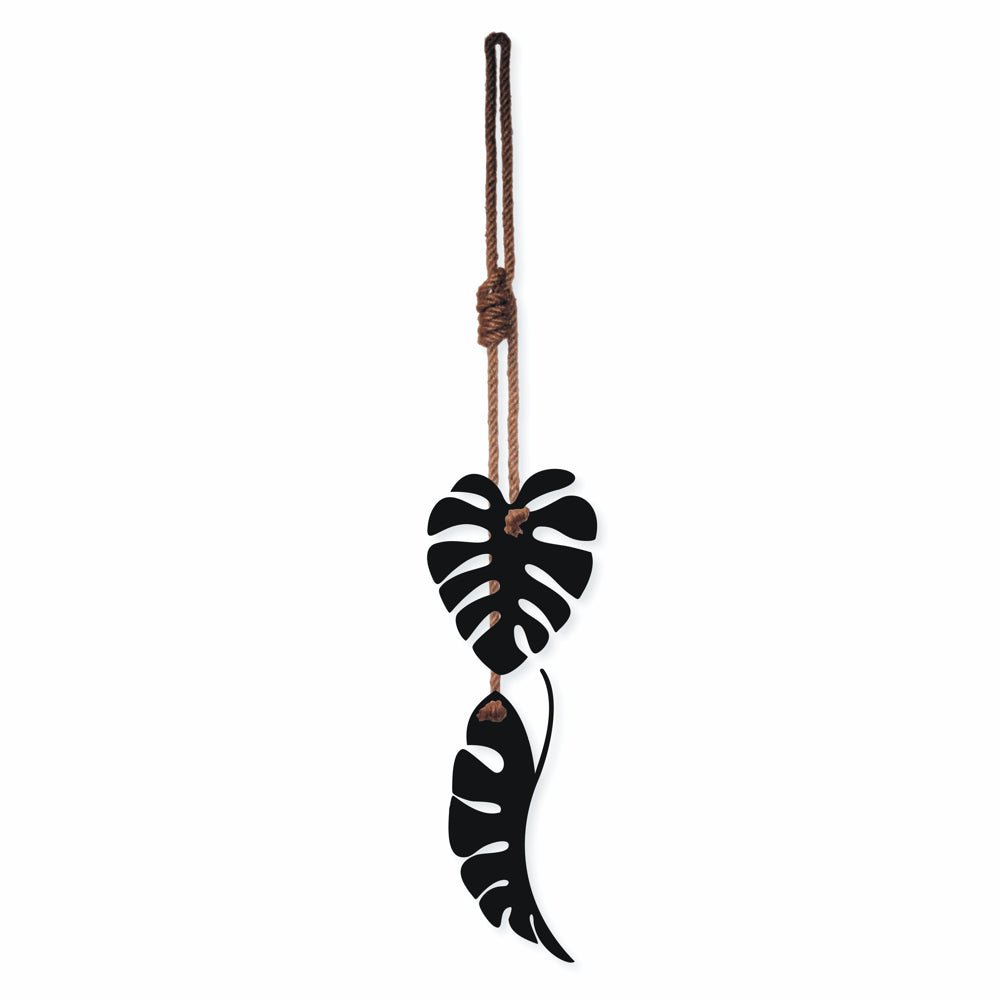 NZ-made black steel monstera leaf wall art hanging on patio wall