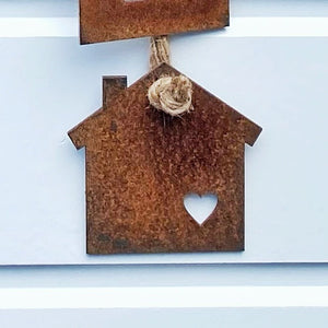 Close up of bottom house in Lisa's vintage wall hanging.
